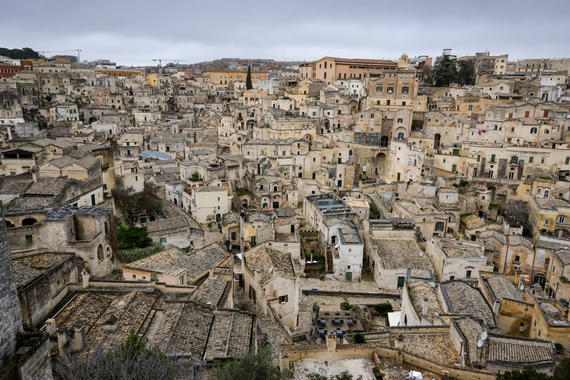 Aerial view of the ancient stone buildings in Matera, showcasing historic Italian architecture.